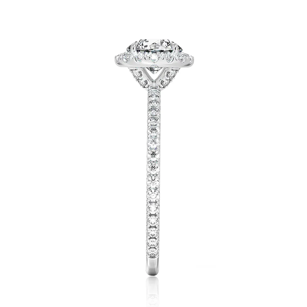 Four Prong Oval Cut Diamond Halo Engagement Ring